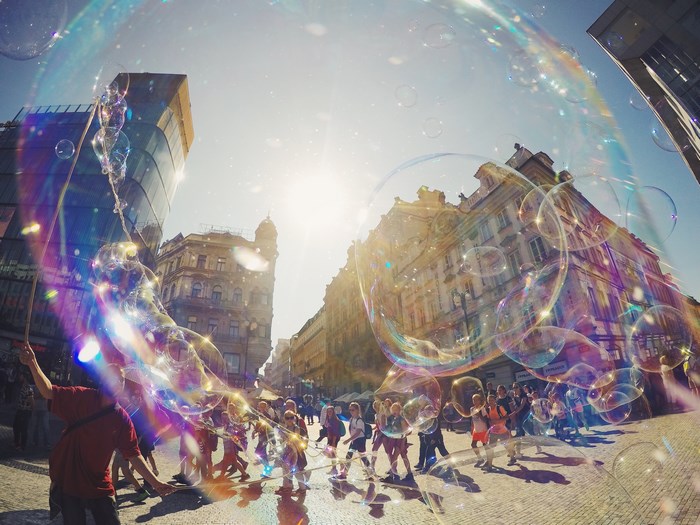 Street performer blowing giant soap bubbles