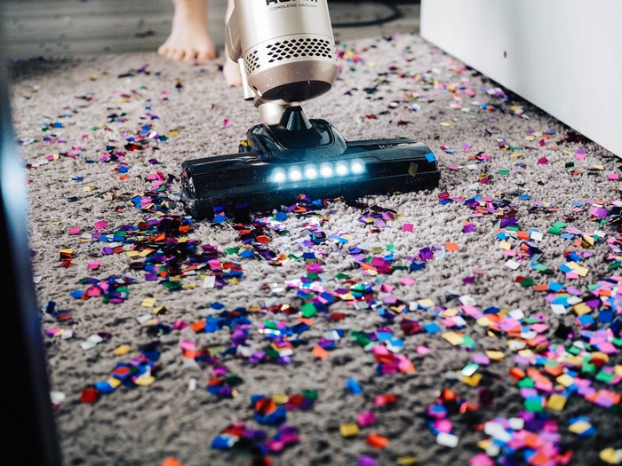 Vacuum cleaning confetti from a carpet
