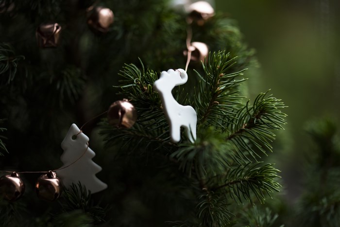 Christmas tree with reindeer and bell ornaments