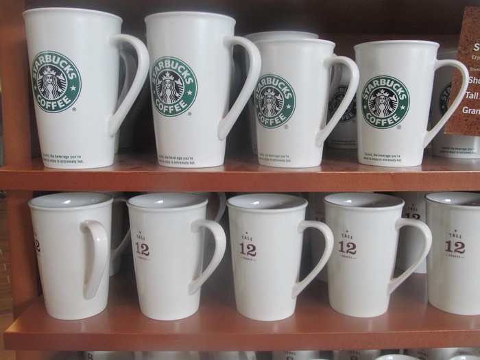 Starbucks coffee mugs on shelves