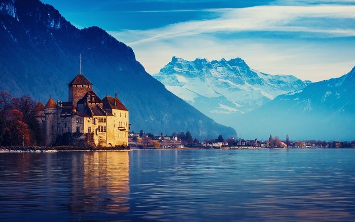 Chillon Castle on Lake Geneva with Swiss Alps