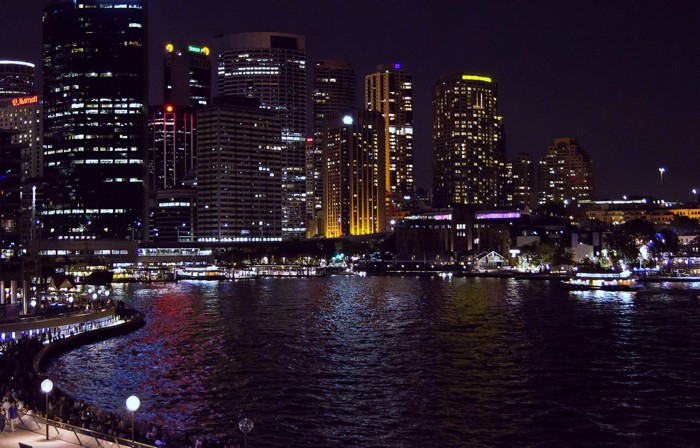 Sydney skyline at night with harbor