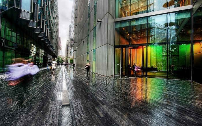 People walking on a wet street in London, England