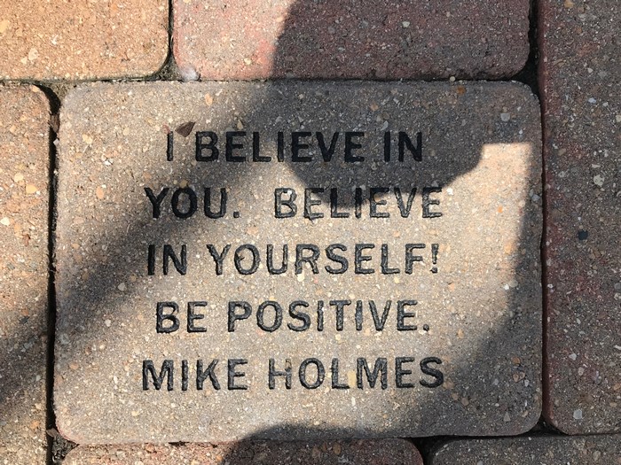 Inspirational quote on a brick by Mike Holmes