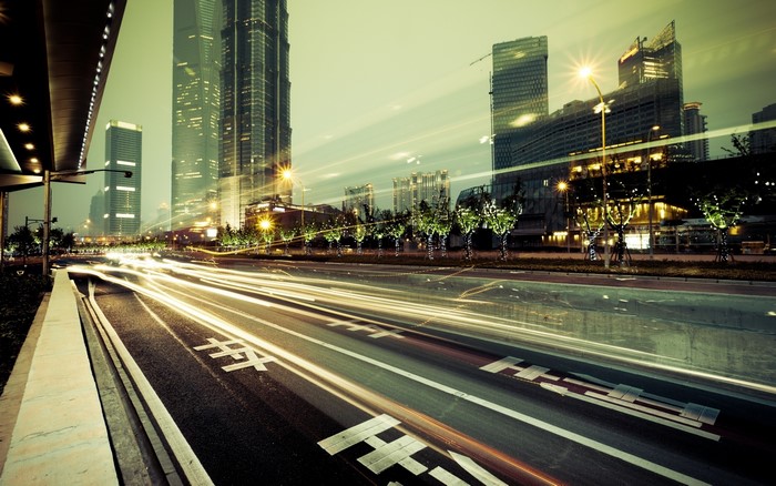 City road at night with light trails