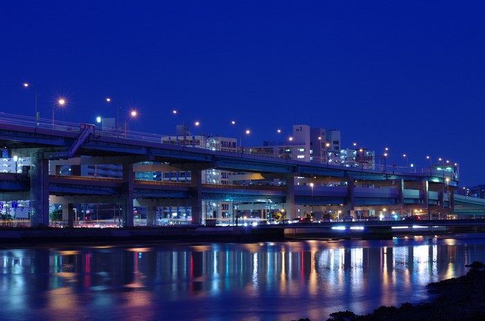 Night highway overpass and river in Fukuoka
