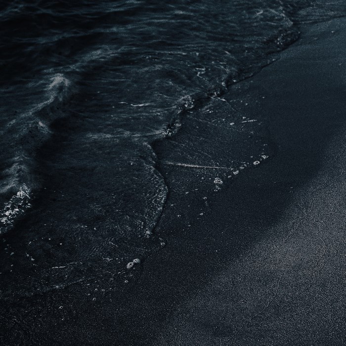 Dark Ocean Waves on Black Sand Beach