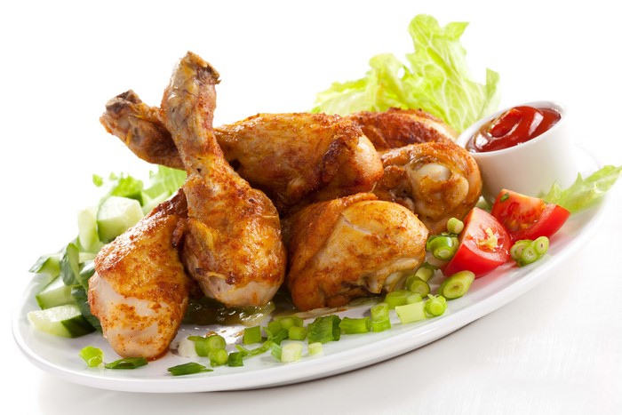 Plate of Fried Chicken Legs with Salad and Ketchup