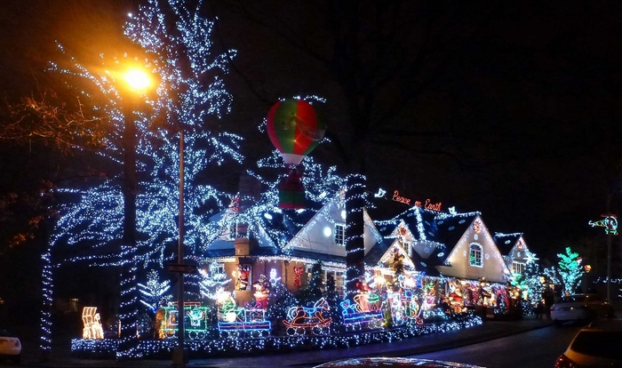 Christmas lights display on houses and trees