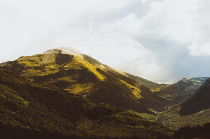 Sunlit Mountain Slopes in Scotland