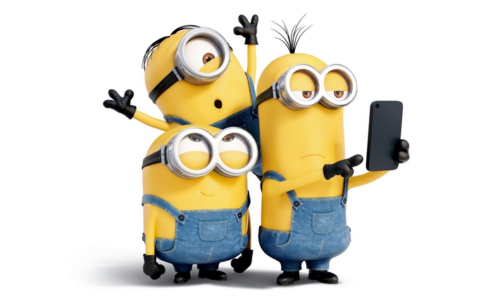 Three Cheerful Minions Posing for a Selfie