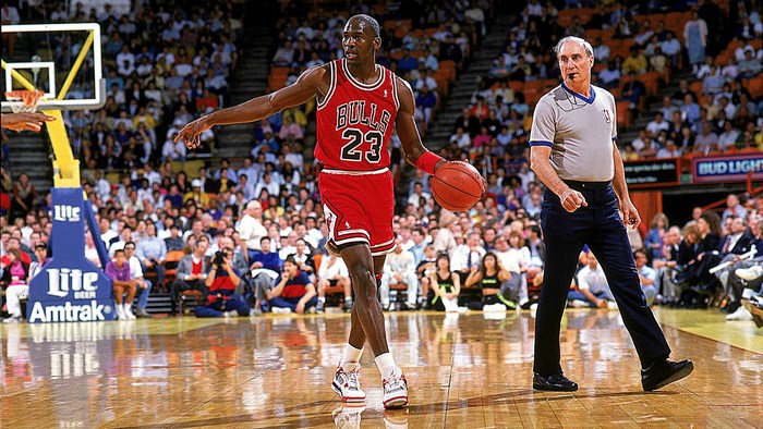 Michael Jordan and referee on basketball court