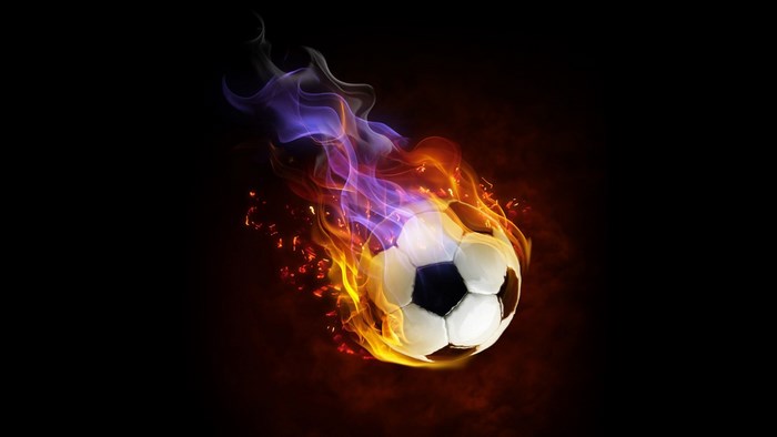 Soccer ball on fire with colorful flames