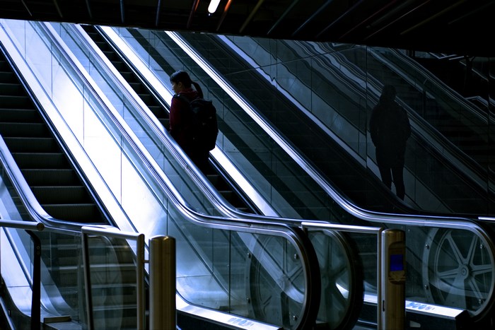 Woman on escalator in Rotterdam