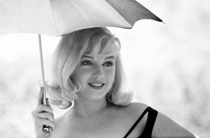 Marilyn Monroe holding an umbrella