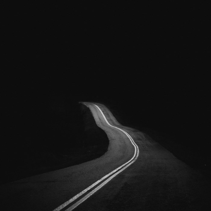 Lonely Winding Road at Night in Black and White