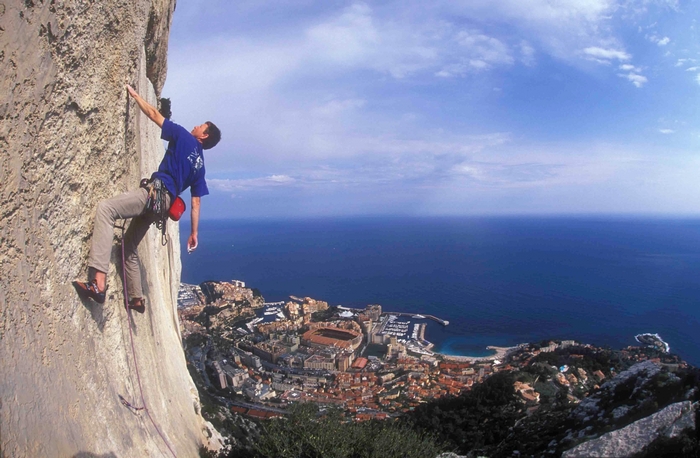 Rock climber overlooking Monaco