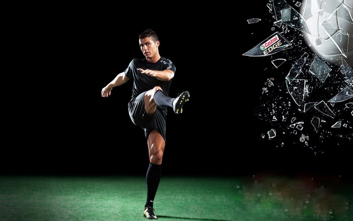 Cristiano Ronaldo kicking a soccer ball with Castrol EDGE logo