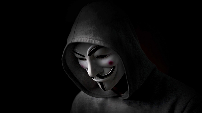 Anonymous mask wearer in a hoodie