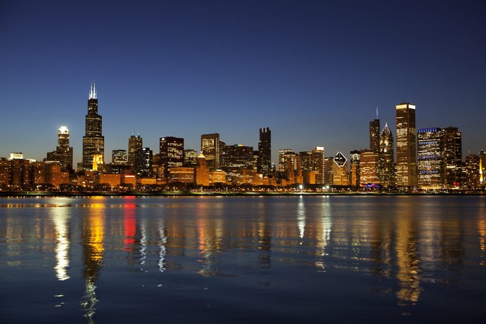 Chicago skyline at night with reflections