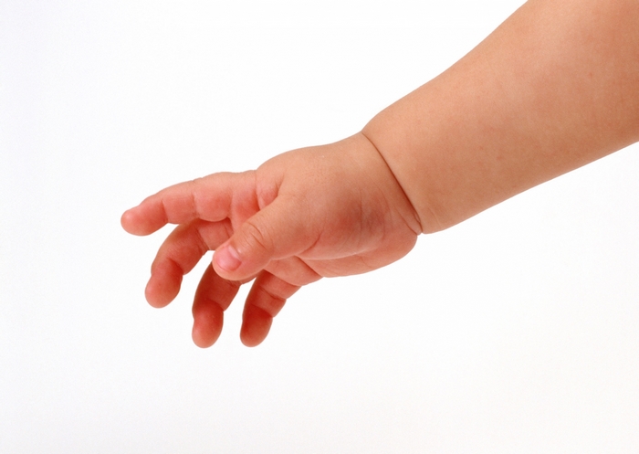 Baby's Hand Reaching Out