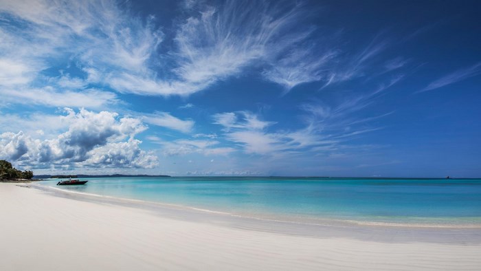 White Sand Beach with Turquoise Water and Blue Sky