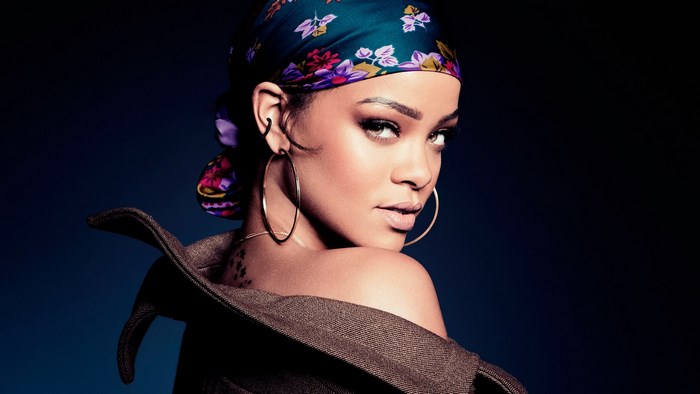Rihanna wearing a headscarf and hoop earrings