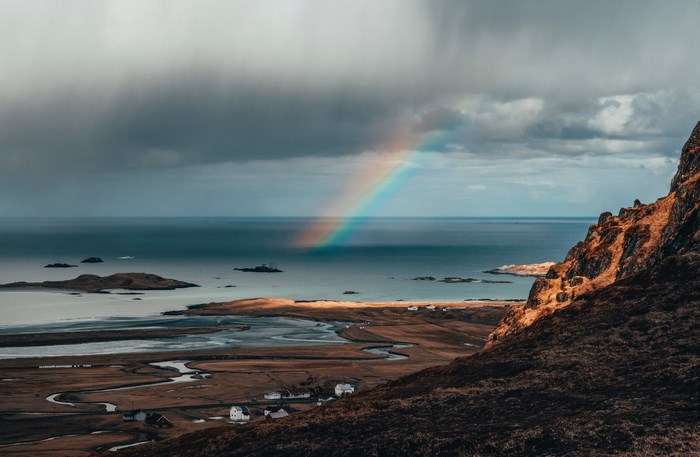 Coastal landscape with a rainbow over the sea