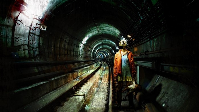 Girl with gas mask in subway tunnel