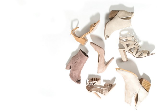 Assortment of women's heeled shoes on a white background