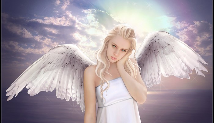 Angel with white wings in the sky