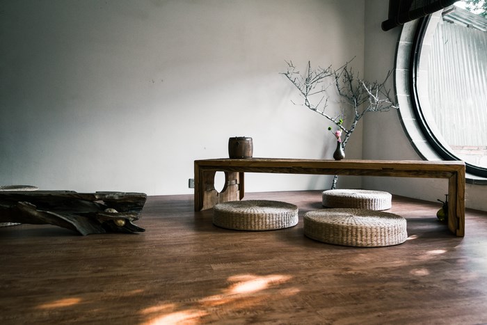 Chinese tea room with wooden table and straw mats