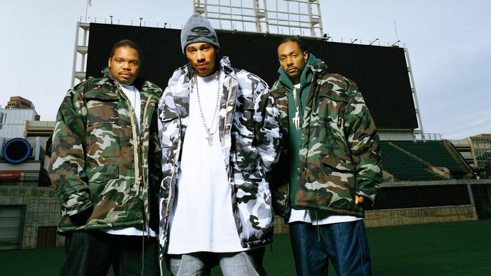 Bone Thugs-n-Harmony in front of stadium screen