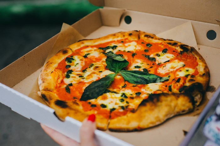 Pizza Margherita in a cardboard box