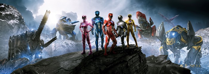 Power Rangers 2017 characters and Zords on rocky terrain