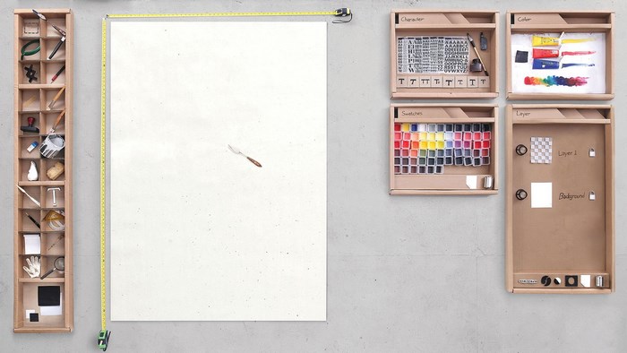 Illustrator tools and art supplies arranged on a wall