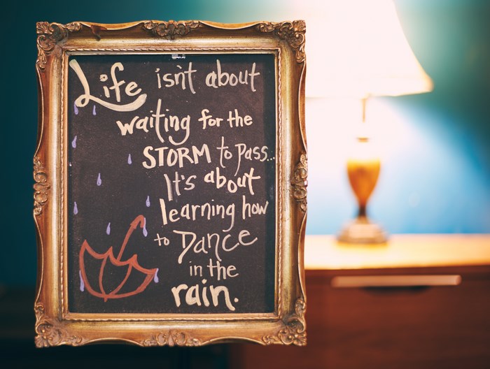 Chalkboard quote about life and dancing in the rain