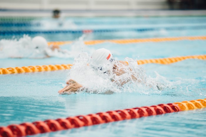 Swimmer in a swimming pool race