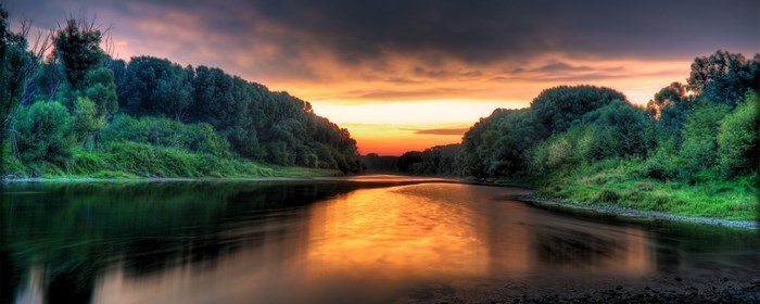 River at sunset with trees