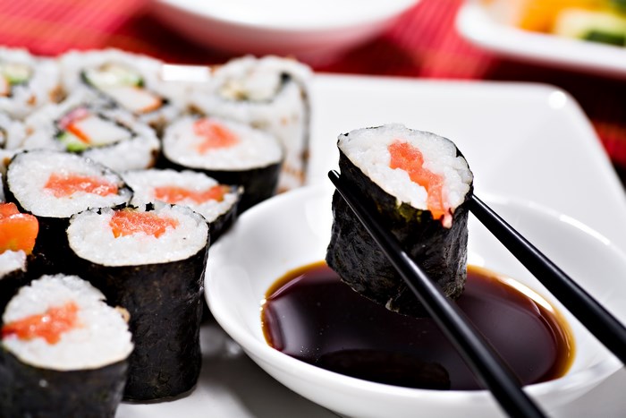 Sushi rolls with salmon and soy sauce