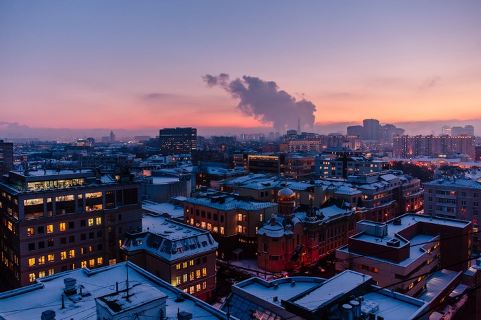Moscow cityscape at sunset with snow-covered rooftops