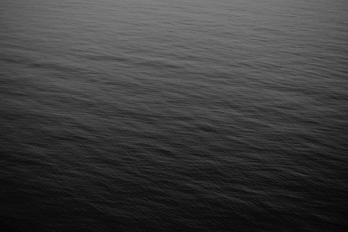 Dark water surface with ripples