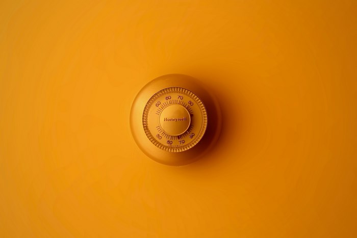 Honeywell safe dial on orange background