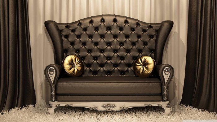 Luxury tufted leather sofa with gold pillows