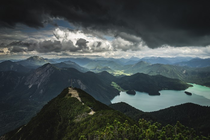 Stormy clouds over a mountain range and lake