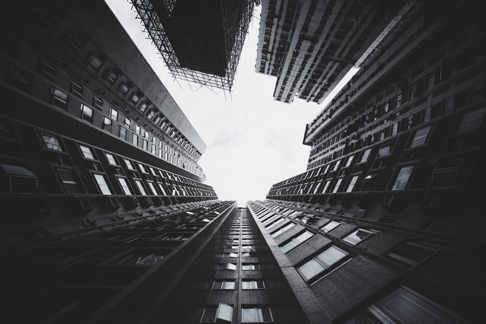Looking up at Hong Kong skyscrapers with scaffolding