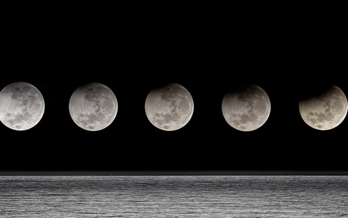 Moon phases over the ocean