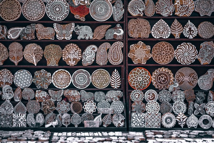Handmade wooden stamps with traditional patterns at a market stall
