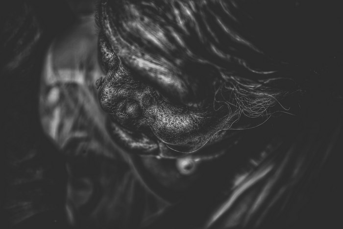 Close-up of an elderly woman's face in black and white