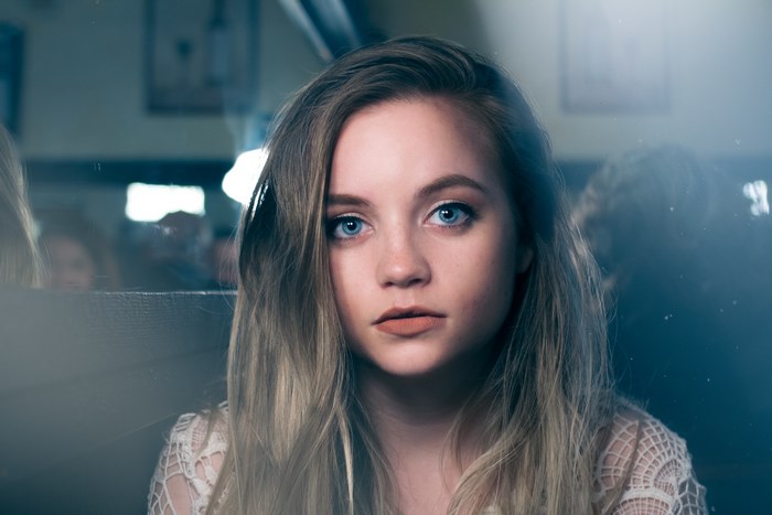 Woman with blue eyes in a cafe